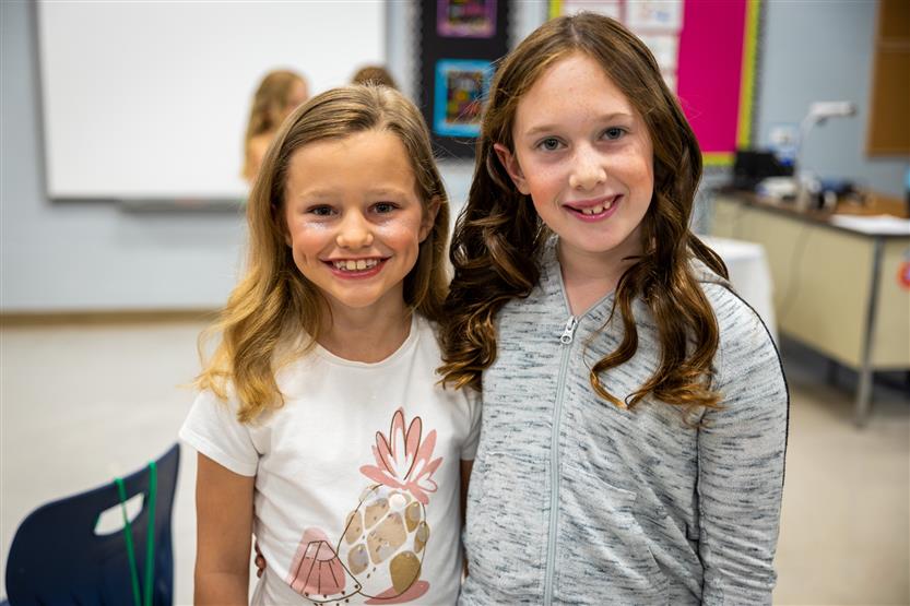 Two girls smile
